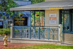 Art deco awning covering entrance to Uptown Kitchen at Third & Main